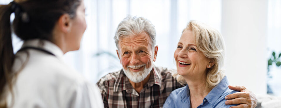 mature couple talking to their doctor